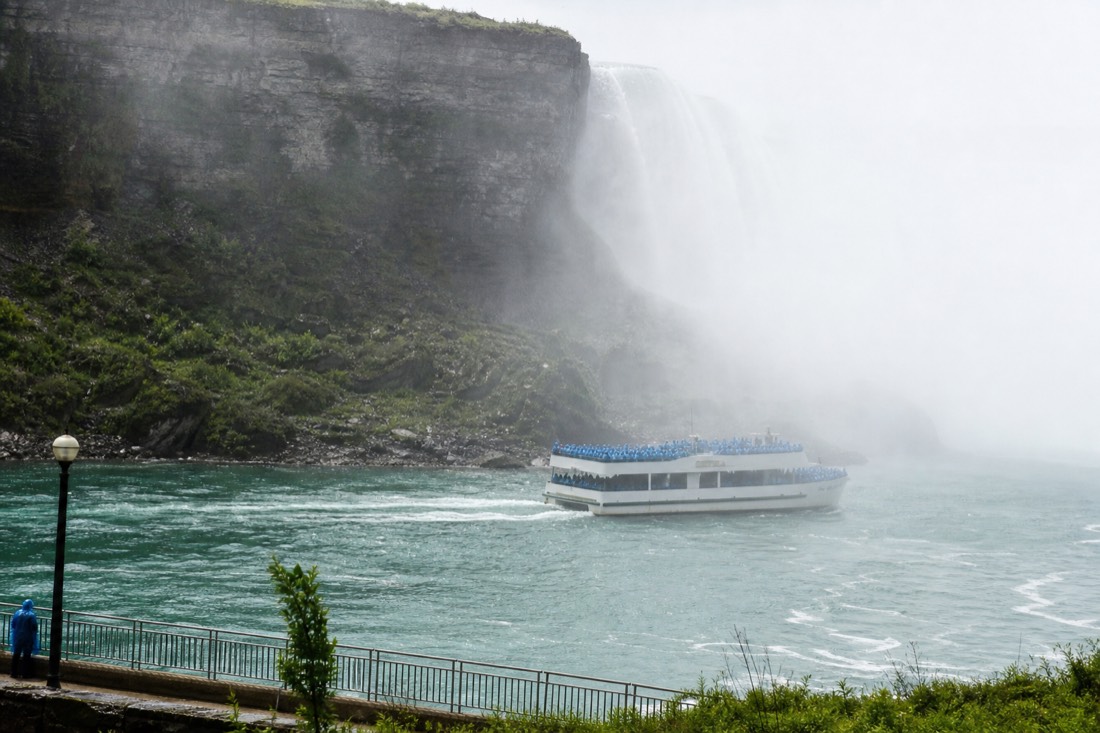 A double-deck catamaran heading into the mist below Horseshoe Falls