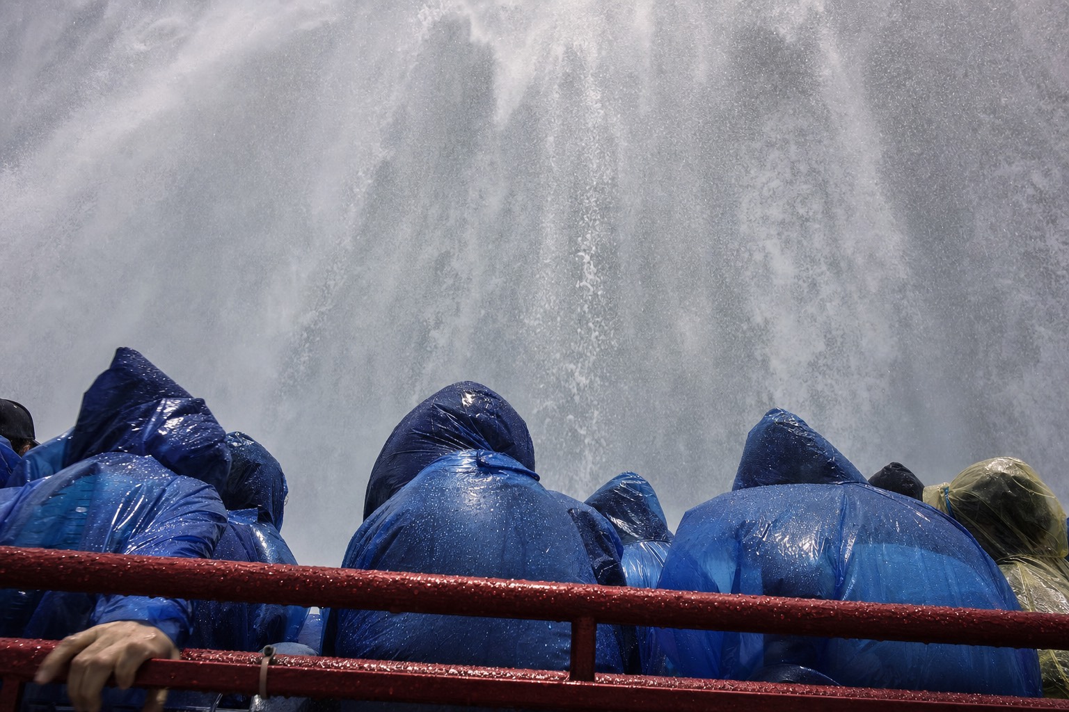 The view from a boat deck inside the Horseshoe Falls basin, water landing out of white spray